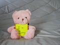 Post it with teddy doll Royalty Free Stock Photo