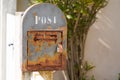 Post text sign on an old private mailbox of an old and rusty house Royalty Free Stock Photo