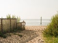 Post in the water and a beach on Fire Island, New York Royalty Free Stock Photo