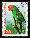 Postage stamp Cinderella 1998. Red masked parakeet Psittacara erythrogenys Royalty Free Stock Photo