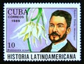 Postage stamp Cuba 1989. Ruben Dario and brassavola acaulis orchid flower Royalty Free Stock Photo