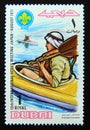 Postage stamp Dubai, 1971. Scouts in the canoe