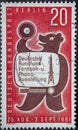 A postage stamp from Germany, Berlin showing the Berliner BÃÂ¤r with vinyl and television. Radio exhib
