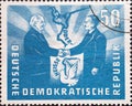 a postage stamp from Germany, GDR showing the politicians Wilhelm Pieck and BolesÃâaw Bierut in front o Royalty Free Stock Photo