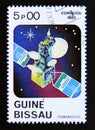 Postage stamp Guinea Bissau, 1983. Satellite in space orbit Royalty Free Stock Photo