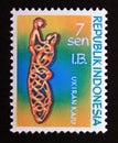 Postage stamp Indonesia West Irian 1970. Child on top filigree carving wooden carved statue