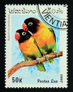 Postage stamp Laos 1997. Masked Lovebird Agapornis personata Royalty Free Stock Photo