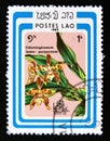 Postage stamp Laos, 1985. Odontoglossum luteo purpureum orchid flower