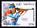 Postage stamp Laos 1991, Olympic Games Biathlon contestant