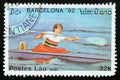 Postage stamp Laos 1991, Olympic Games one man kayak contestant Royalty Free Stock Photo