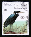 Postage stamp Laos, 1990. Pacific Reef Heron Egretta sacra bird