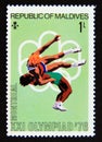 Postage stamp Maldives, 1976. Wrestling Summer Olympic Games 1976 Montreal Royalty Free Stock Photo