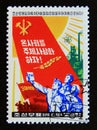 Postage stamp North Korea, 1981. Marchers with book, banners