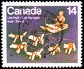 Postage stamp printed in Canada shows Dogteam and Dogsled ivory sculpture by Abraham Kingmeatook, Native Amerindians of Canada Royalty Free Stock Photo