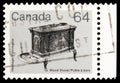 Postage stamp printed in Canada shows Wood stove, 64 ÃÂ¢ - Canadian cent, Heritage Artifacts serie, circa 1983