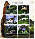 Postage stamp printed in Cinderellas shows Allosaurus and Triceratops Dinosaurs, Mali serie, circa 2016