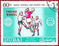 Postage stamp printed in Dubai with a picture of a footballs players, with the inscription `World Football Cup London 1966`