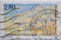 A postage stamp printed in France showing a painting by the French artist Paul CÃÂ©zanne: Montagne Sainte-Vict