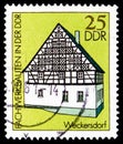 Postage stamp printed in Germany, DDR, shows Wohnstallhaus house alarm village, Half-timbered Buildings in the GDR serie, circa