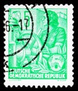 Postage stamp printed in Germany, Democratic Republic, shows Woman at the steering wheel, Five year plan serie, circa 1953