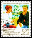 Postage stamp printed in Germany, Democratic Republic, shows Young pair, Stamps Exhibition of Young Philatelists serie, circa 1973 Royalty Free Stock Photo