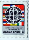 A postage stamp printed in Hungary shows Earth flags dedicated to International Savings Day circa 1979