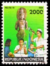 Postage stamp printed in Indonesia shows Doctor, nurse and children, Five Year Development Plan serie, circa 1994
