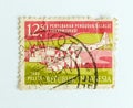Jakarta, Indonesia : Postage stamp shows transmigration program, circa 1980 Royalty Free Stock Photo