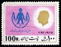 Postage stamp printed in Iran shows Reform of child support, 14th anniversary of the `White Revolution` serie, circa 1977 Royalty Free Stock Photo