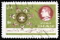 Postage stamp printed in Iran shows Scout badge surrounded by knotted neckerchiefs, Week of cooperation of the Boy Scouts serie, Royalty Free Stock Photo