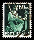 Postage stamp printed in Italy shows Peasant grafting a tree, Democracy serie, circa 1945