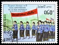 Postage stamp printed in Laos shows Parade, 15th Anniversary Of The People's Republic serie, circa 1990