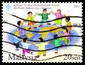 Postage stamp printed in Malaysia shows Children, 50th World Children`s Day serie, circa 2003