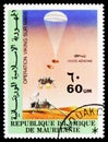 Postage stamp printed in Mauritania shows Landing process, Viking Mars project serie, circa 1979
