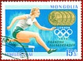 Postage stamp printed in Mongolia with a picture of four-time Olympic champion Francina Blankers-Koen Athletics