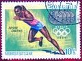 Postage stamp printed in Mongolia with a picture of four-time Olympic champion Jesse Owens Athletics