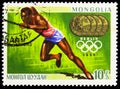 Postage stamp printed in Mongolia shows J. Owens, Gold medalists at the 8th to the 19th Summer Olympic Games serie, circa 1969