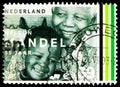 Postage stamp printed in Netherlands shows Mandela With Child, Nelson Mandela birthday 85 years serie, circa 2003 Royalty Free Stock Photo