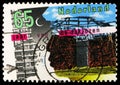 Postage stamp printed in Netherlands shows Modern building and primitive hut, International Year of Shelter for the Homeless serie Royalty Free Stock Photo