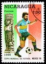 Postage stamp printed in Nicaragua shows Footballplayer + Sculpture, FIFA World Cup 1986 - Mexico serie, 1 C$ - Nicaraguan cÃÂ³ Royalty Free Stock Photo