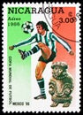 Postage stamp printed in Nicaragua shows Footballplayer Sculpture, FIFA World Cup 1986 - Mexico serie, 3 C$ - Nicaraguan cÃÂ³ Royalty Free Stock Photo