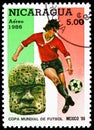 Postage stamp printed in Nicaragua shows Footballplayer + Sculpture, FIFA World Cup 1986 - Mexico serie, 5 C$ - Nicaraguan cÃÂ³ Royalty Free Stock Photo