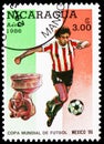 Postage stamp printed in Nicaragua shows Footballplayer + Sculpture, FIFA World Cup 1986 - Mexico serie, 3 C$ - Nicaraguan cÃÂ³ Royalty Free Stock Photo