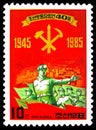 Postage stamp printed in North Korea shows Armed threatened employees, The 40th Anniversary of Korean Workers` Party serie, circa