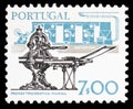 Postage stamp printed in Portugal shows Hand press and modern printing press, Development of Technology serie, circa 1978 Royalty Free Stock Photo