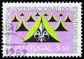 Postage stamp printed in Portugal shows Tents and Scout emblems, 18th International Conference of Scouting serie, 3.50 $ -