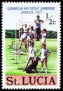 Postage stamp printed in Saint Lucia shows Children and dog, Carribean Boy Scout Jamboree - Jamaica 1977 serie, circa 1977