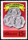 Postage stamp printed in Saint Vincent and the Grenadines shows Coins totaling 15 cents, Eastern Caribbean Currency - Coins and Royalty Free Stock Photo