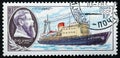 Postage stamp printed in the Soviet Union in 1980. Ship, research icebreaker Otto Schmidt. Bas-relief of the scientist: