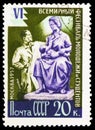 Postage stamp printed in Soviet Union shows Sculptor with motherhood statue, 6th World Youth Festival serie, circa 1957